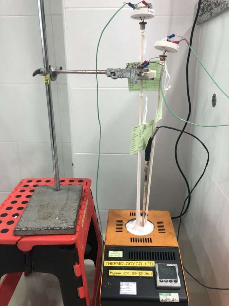 Vertical shot: technician handling temperature sensors in calibration lab
